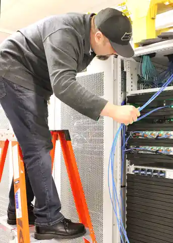 Network installation Kansas City Metro - professional technician working on structured cabling